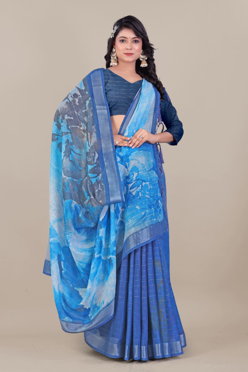 Blue linen saree with silver zari border and watercolor print