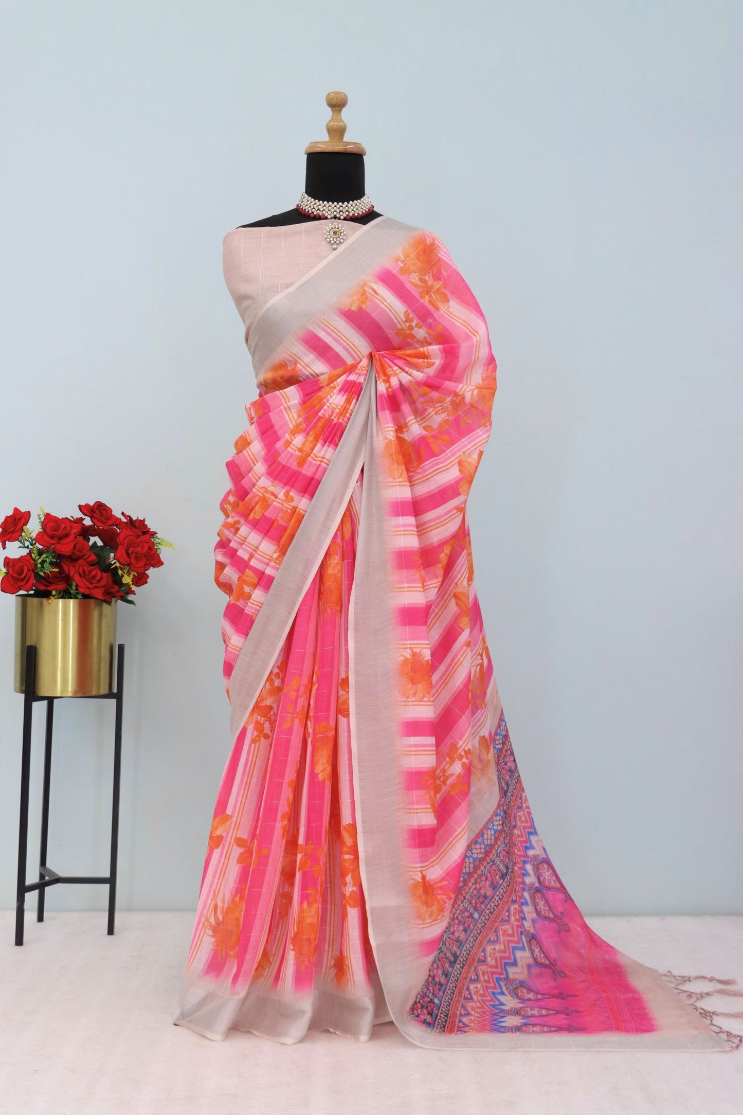 Pink linen saree with silver zari border and floral stripes