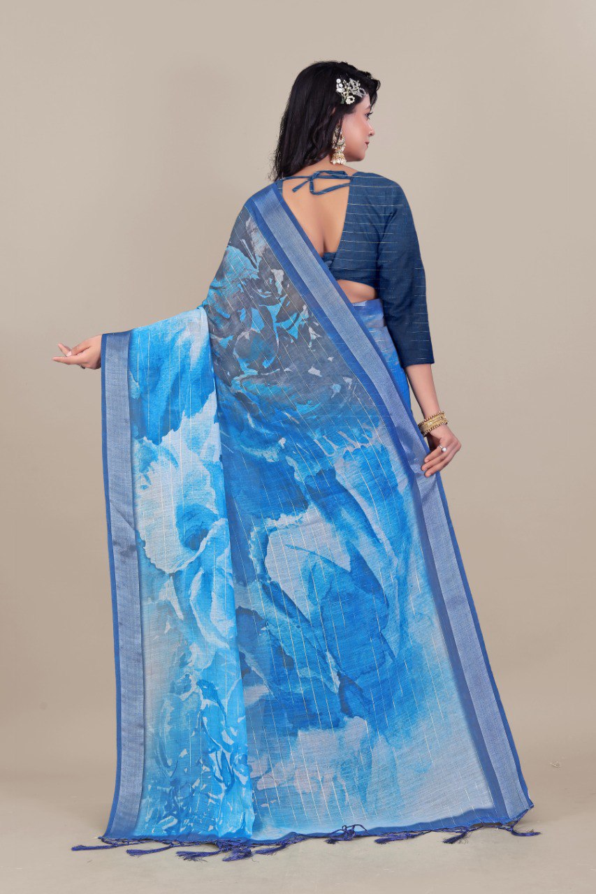 Blue linen saree with silver zari border and watercolor print
