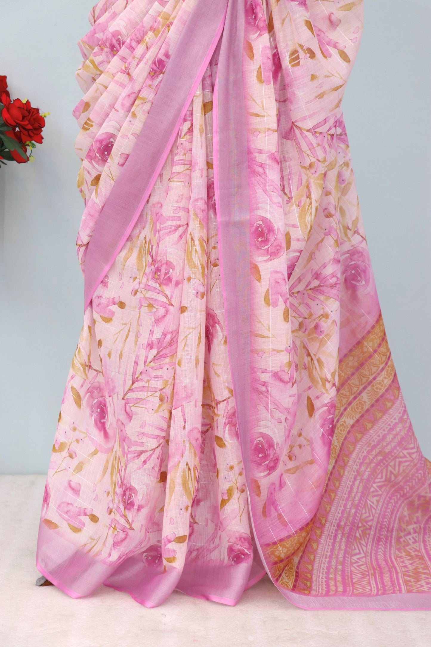 Pink Floral Linen Saree on Mannequin with Zari Border
