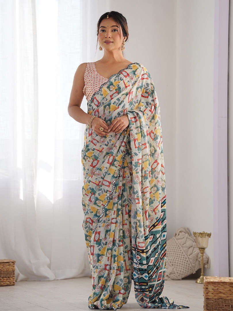 Woman wearing soft georgette printed saree with scallop border