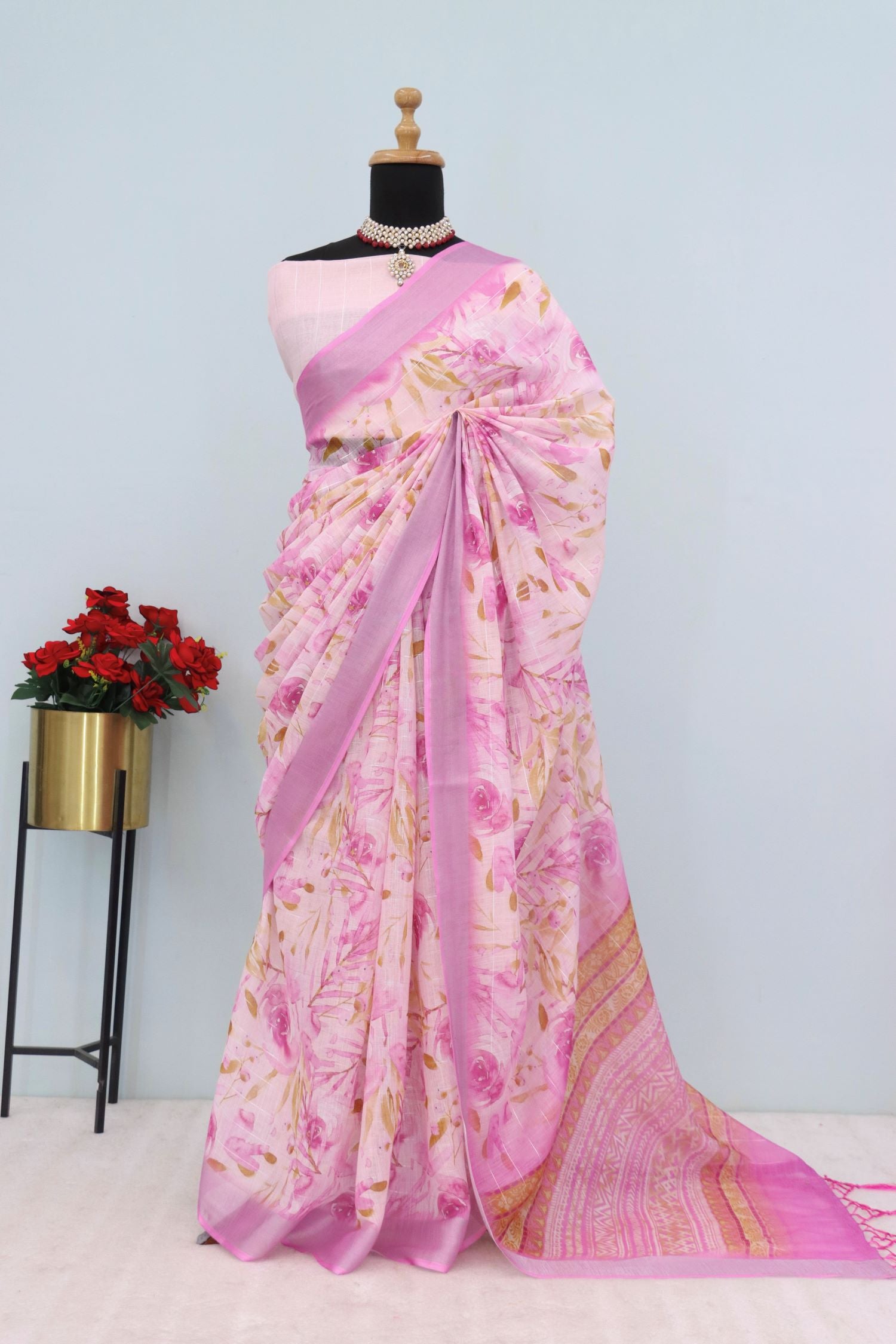 Pink Floral Linen Saree on Mannequin with Zari Border