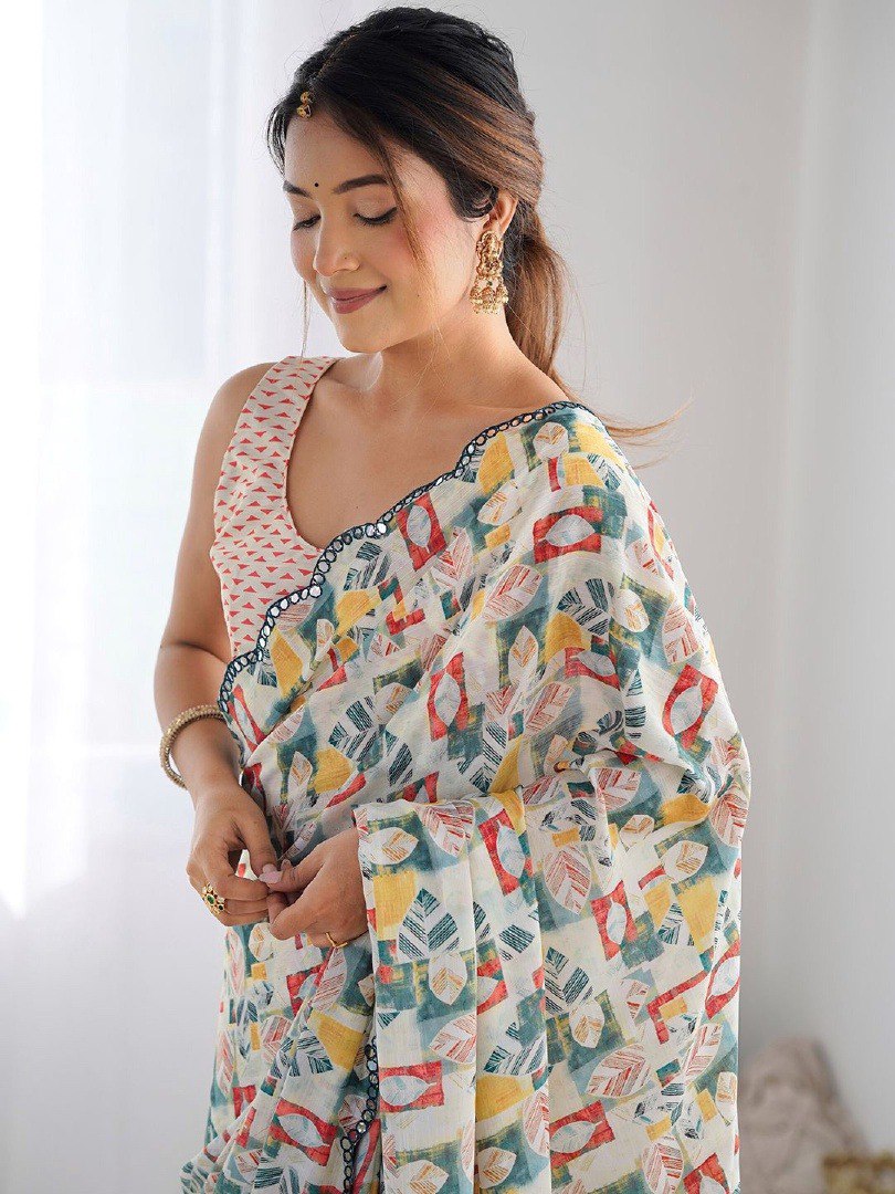 Woman wearing soft georgette printed saree with scallop border