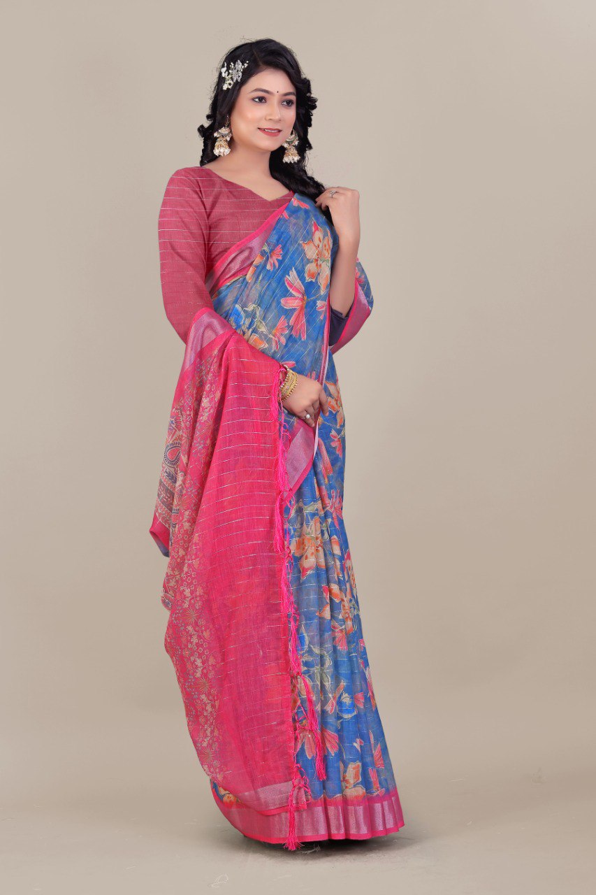 Woman wearing blue floral printed linen cotton saree with pink silver zari border