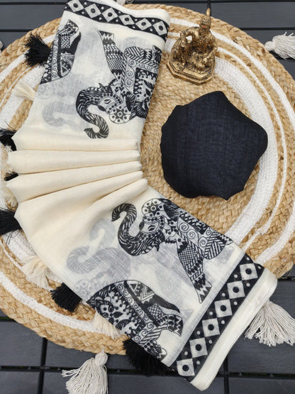 Woman wearing a white linen cotton saree with black elephant print