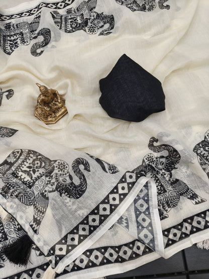 Woman wearing a white linen cotton saree with black elephant print