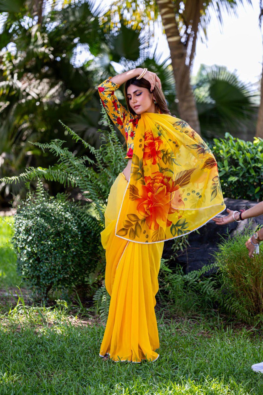 Yellow soft georgette saree with red and orange floral print