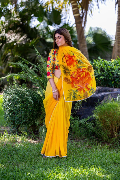 Yellow soft georgette saree with red and orange floral print