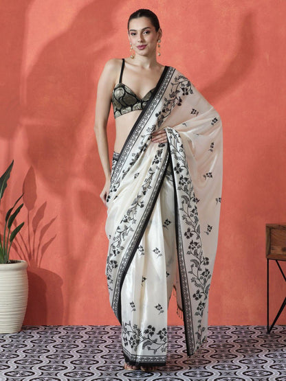Model wearing white pure Gajri silk saree with black floral embroidery
