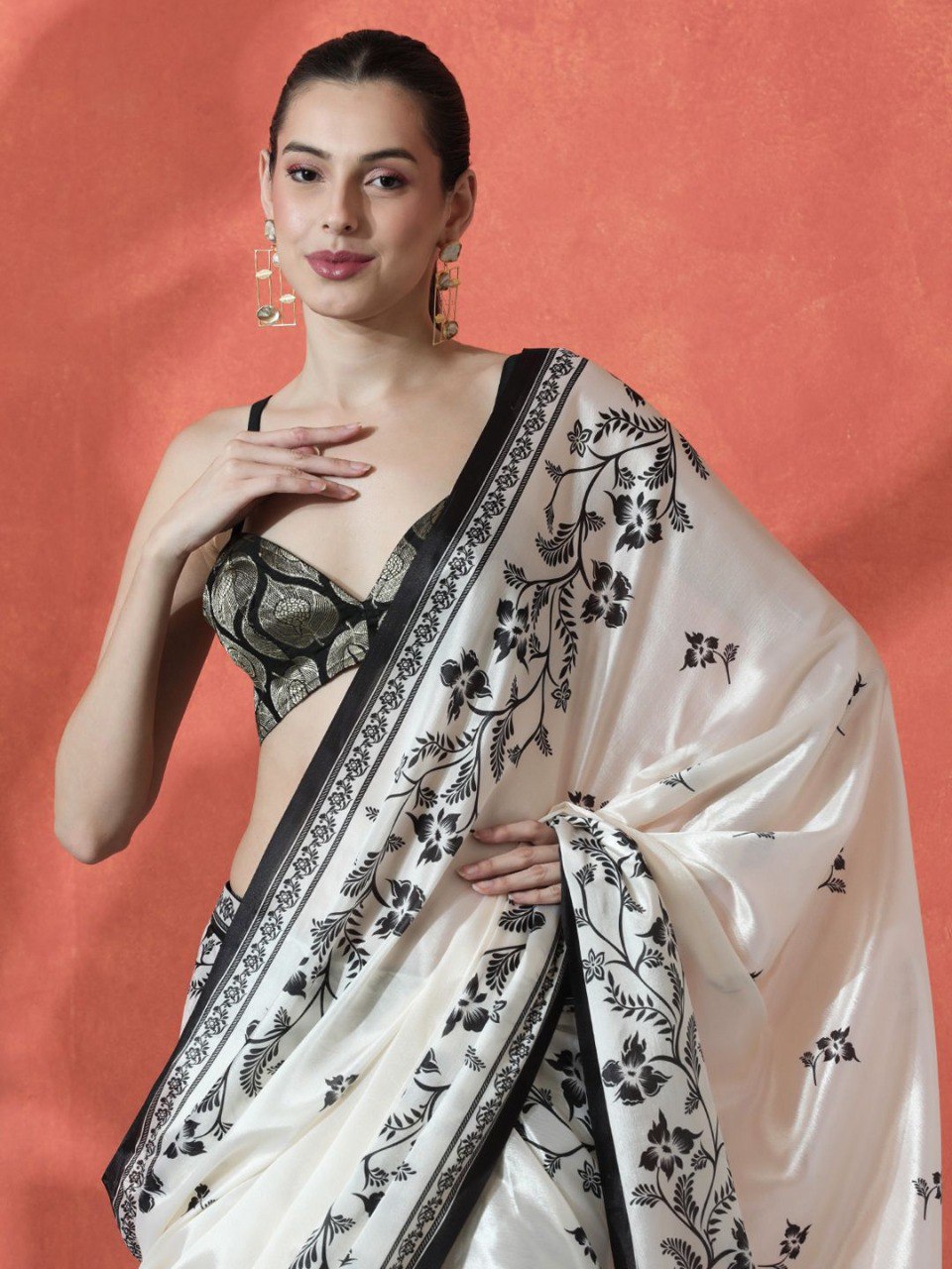Model wearing white pure Gajri silk saree with black floral embroidery