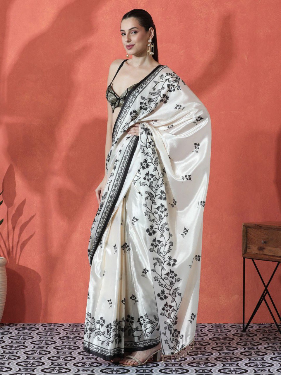 Model wearing white pure Gajri silk saree with black floral embroidery