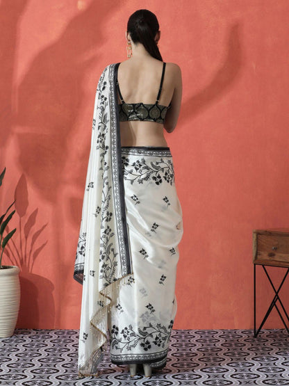 Model wearing white pure Gajri silk saree with black floral embroidery